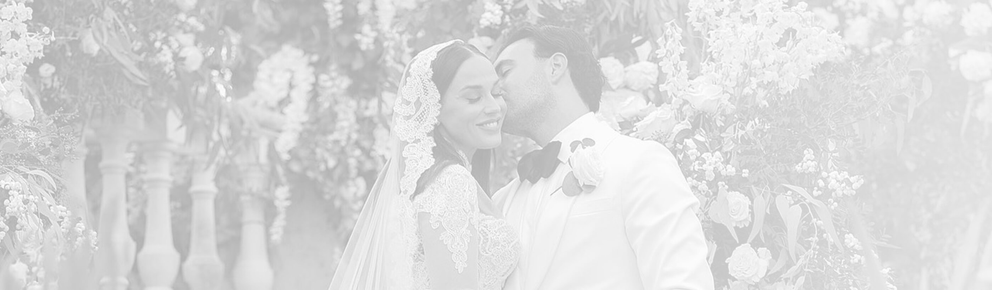 Photo of the kissing bride and groom - Desktop Image